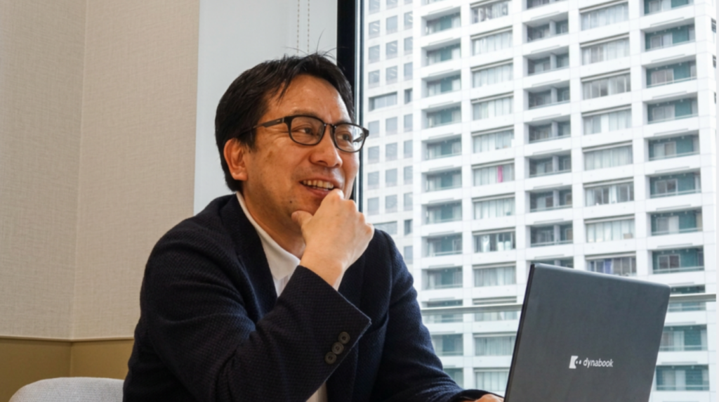 インタビューに答えるキューサイ 小森谷裕之氏